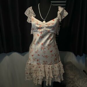 White floral ruffle mini dress with adjustable straps and tie back #festivalvibe